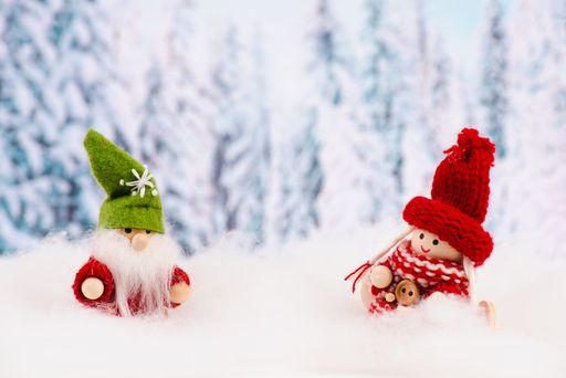 Little cute girl and christmas elf standing in the snow, forest, festive greeting card, copy space, wintertime