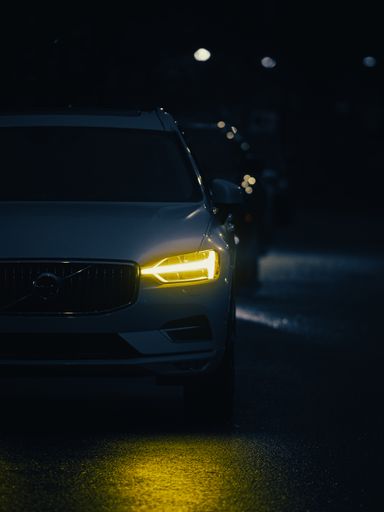 A vertical shot of a Volvo vehicle with yellow headlamps
