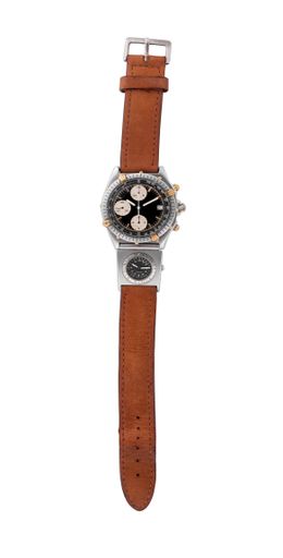 A closeup of a stylish watch with a brown band under the lights isolated on a white background