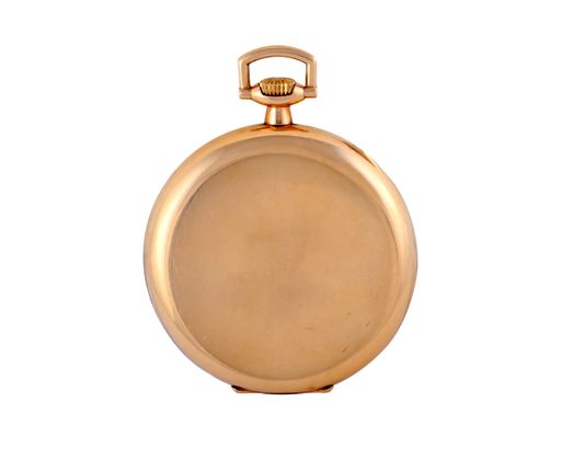 A small golden pocket watch under the lights isolated on a white background