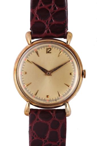 A modern watch with a red leather band under the lights isolated on a white background