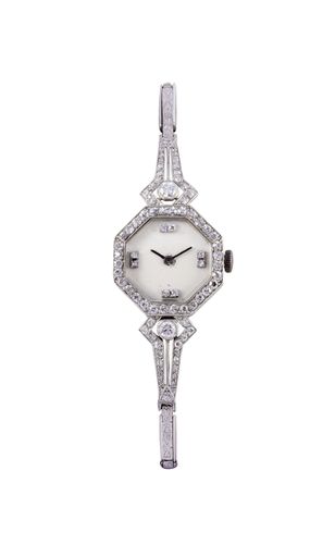 A vertical shot of a modern watch with white gemstones under the lights isolated on a white background