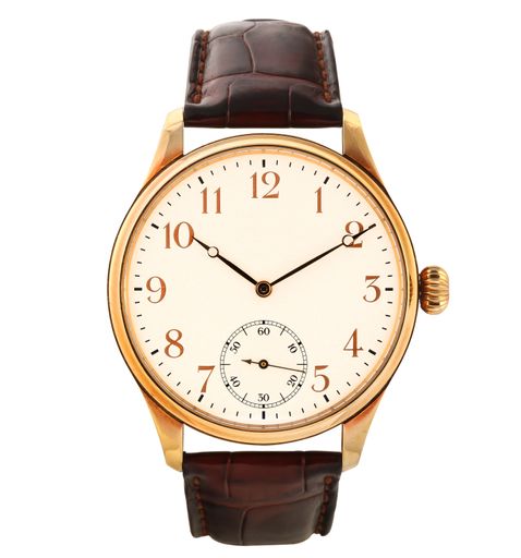 A modern watch with a brown leather band under the lights isolated on a white background