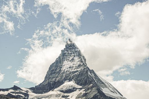 A beautiful view of stunning Swiss alps covered by snow in summer