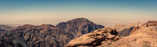 Panorama landscape image of Petra, Jordan at the top of Ad Deir. Travel and tourism.