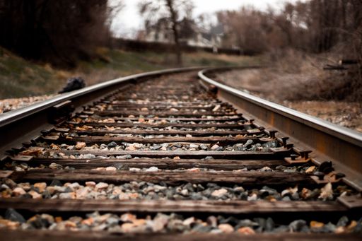 A selective closeup shot of a train rail