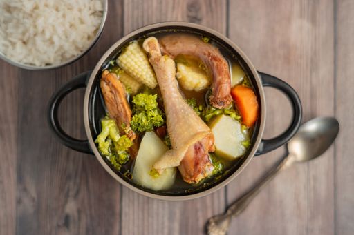 An overhead shot of Honduran chicken soup on the table