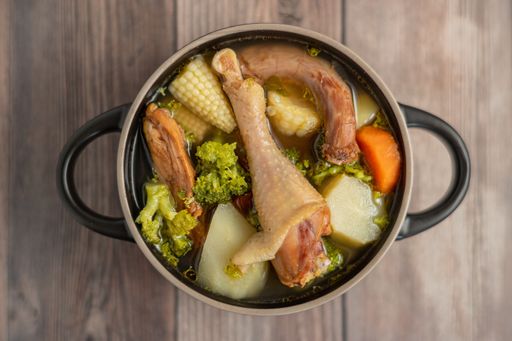 An overhead shot of Honduran chicken soup on the table