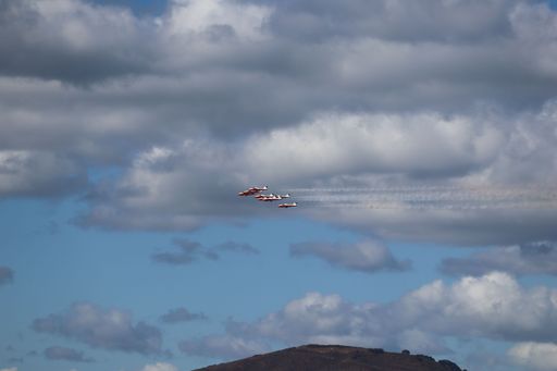 Belly view of Canadian Snowbirds flying in formation with smoke trails at San Francisco Fleet Week