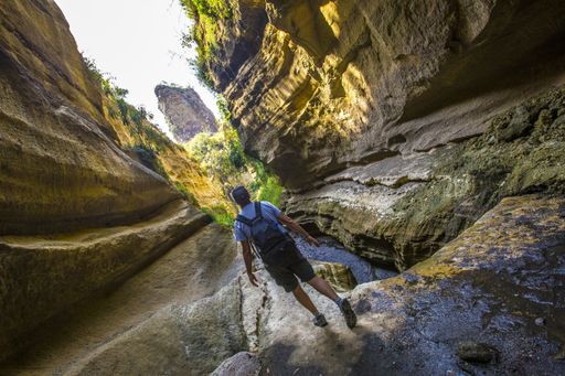 A male standing among the cliffs captured in Naivasha Hells Gate National Park. Kenya
