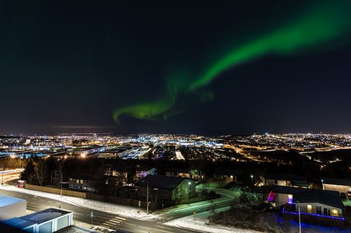 A mesmerizing shot of the northern lights over Reykjavik, Iceland