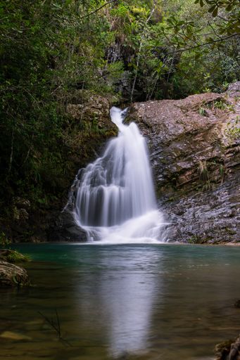 A beautiful small waterfall flowing over the rocks