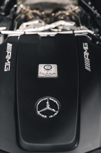 A closeup shot of Mercedes luxury car's logo from a car show in Epping NH, United States