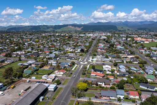 Aerial shot of Levin looking along Queen St from the west to the centre of town to the Tararua Mountains in the distance.  Taken on a sunny summer day