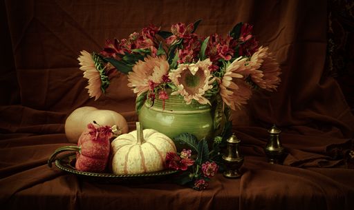 A still life composition with sunflowers, alstroemerias, and white pumpkins stylized as Dutch Flowers