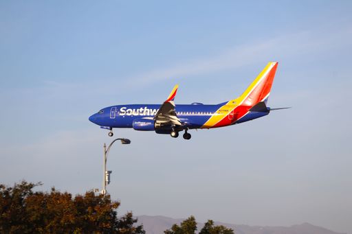 A Southwest Airlines Boeing 737-700 arriving at San Jose International Airport near sunset, coming in from Hollywood Burbank.
