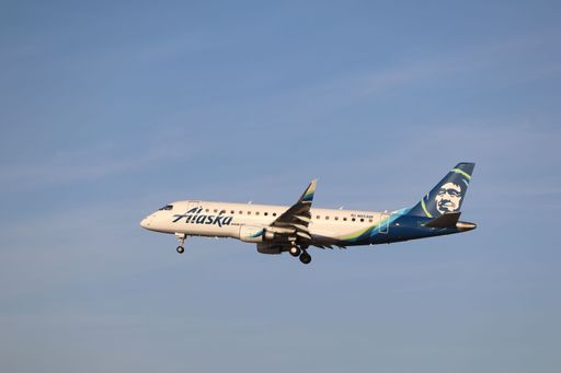 An Alaska Horizon Air Embraer E175 arriving at San Jose International Airport near sunset, coming in from San Diego.