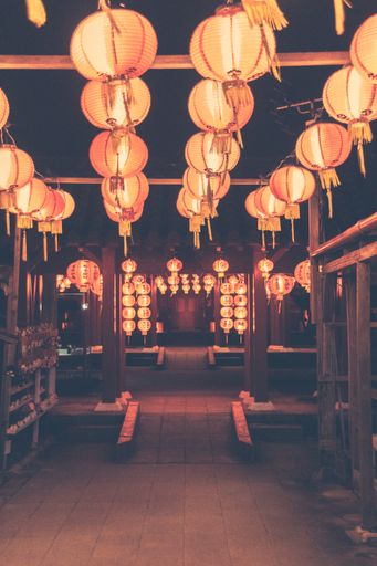A vertical shot of the illuminated streets at the Lantern Festival. Okinawa, Japan.