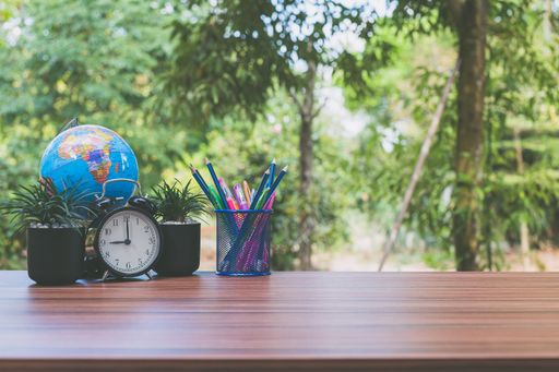 A notebook and office atmosphere with green background in the park