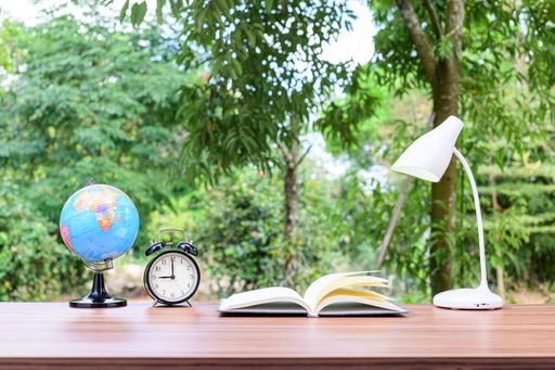 A notebook and office atmosphere with green background in the park