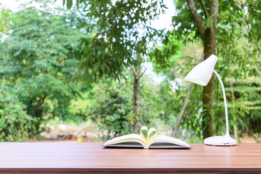 A notebook and office atmosphere with green background in the park