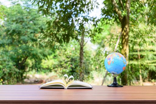 A notebook and office atmosphere with green background in the park