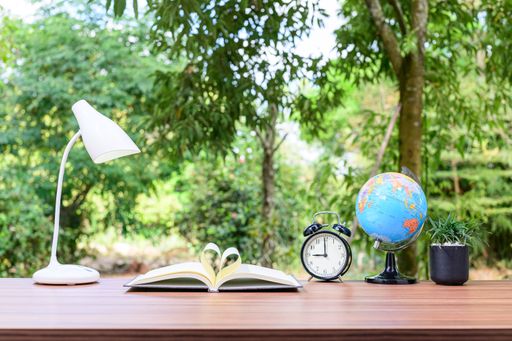 A notebook and office atmosphere with green background in the park