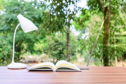 A notebook and office atmosphere with green background in the park