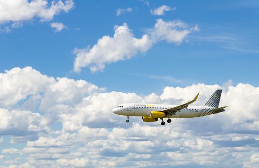 A Vueling Airbus A320 plane, landing at Josep Tarradellas airport in Barcelona