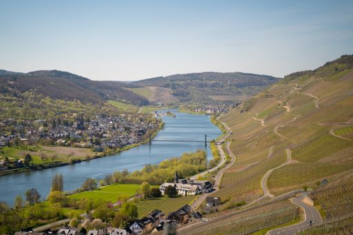The Mosel river flowing near the town of Kroev and Bernkastel Kues in Germany