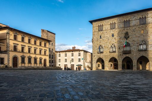A view of Piazza del Duomo, the main square of Pistoia historic center, Tuscany, Italy against a blue sky