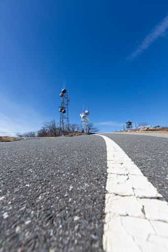A vertical closeup shot of the road leading to the Wachusett mountain tower