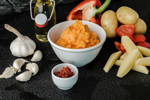 A closeup shot of ingredients and seasonings on a table for dish preparation