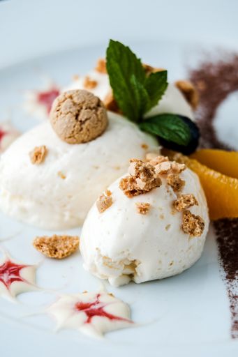 A vertical shot of vanilla ice cream dessert with fruits