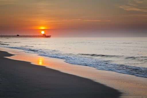 A beautiful scenery of sunrise over the fishing pier in South Carolina