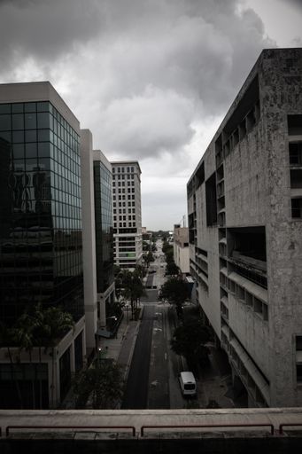 An aerial grayscale shot of Fort Lauderdale city buildings and the streets against a gray cloudy day, USA