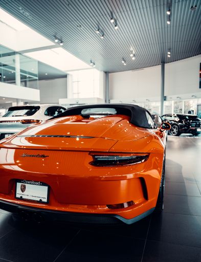 An expensive supercar displayed in the showroom of a car dealership