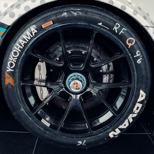 A racing tire of an expensive supercar in the showroom of a car dealership