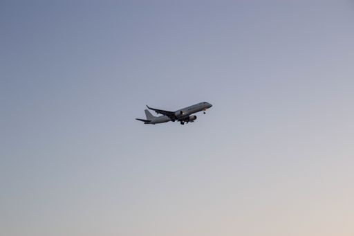A flying commercial plane taking off in Tel Aviv, Israel