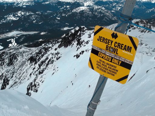 An "Experts only" warning sign on a snowy mountain in Whistler, British Columbia, Canada
