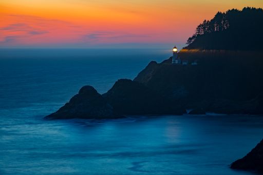 A mesmerizing view of a beautiful seascape with Heceta Lighthouse at scenic sunset in USA