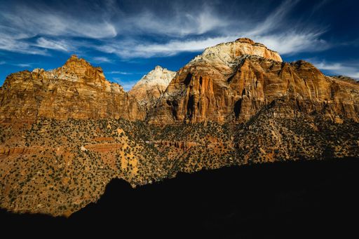 A Mesmerizing scene of rocky mountains against a sunny sky in Zion National Park Springdale, USA
