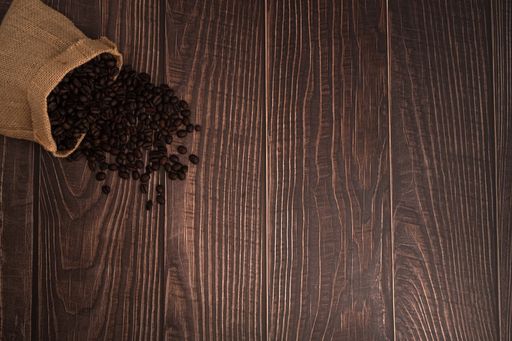 A top view of coffee beans on the wooden table