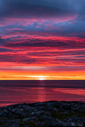 A breathtaking shot of a seascape under the pink and blue skies during the sunset