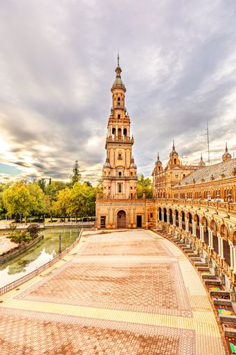 Iconic architecture of Plaza de Espana in Seville under a dramatic sky