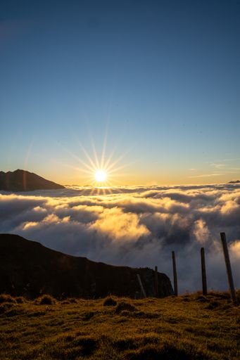 A sunset over clouds at Mount Niederbauen in Switzerland