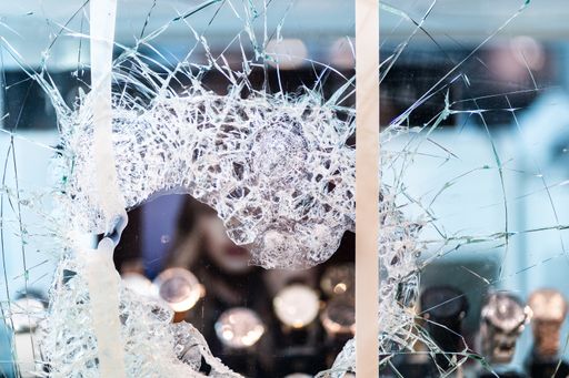Broken window of a jewellery shop. Perfect for illustrating thefts, robberies, rising crime. The poor stealing from the rich