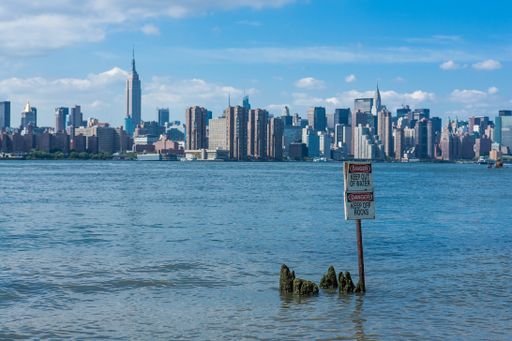A breathtaking scenery of New York City under a blue sunny sky  viewed from State Park