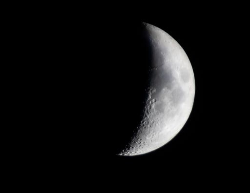 A beautiful view of the crescent moon on a dark background