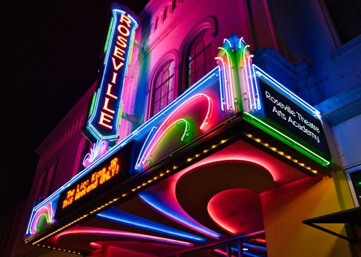 A scenic view of a colorful neon sign in downtown Roseville, the United States